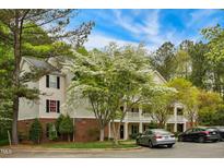 Charming two-story condo building with manicured landscaping and ample parking at 3050 Trailwood Pines Ln # 101, Raleigh, NC 27603