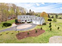Stunning home with manicured lawn and circular driveway at 500 Walnut Hill Dr, Hillsborough, NC 27278