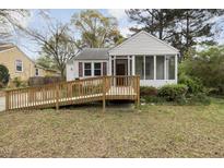 Charming home with a wooden ramp and screened porch, offering accessibility and outdoor enjoyment at 2106 Ruffin St, Durham, NC 27704