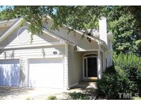 Charming home featuring an attached two-car garage and inviting front entrance at 212 Columbia W Pl, Chapel Hill, NC 27516