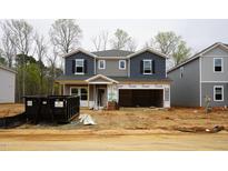A two-story home with blue and grey siding and a two-car garage still under construction at 2202 Cherry Creek Rd, Haw River, NC 27258