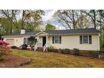 Charming single-story home with a well-maintained front yard and inviting entrance at 2704 Pidgeon Hill Rd, Raleigh, NC 27613