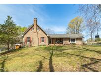Charming brick home with red shutters and a well-manicured lawn offers classic curb appeal at 2746 Moss Creek Loop, Elon, NC 27244