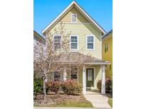 Charming two-story home with a cozy front porch and lush landscaping at 45 Summersweet Ln, Chapel Hill, NC 27516