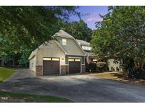 Charming two-story home with a two-car garage and well-maintained landscaping at 181 Fawn Hill Ct, Garner, NC 27529
