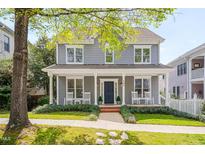 Charming two-story home with gray siding, white trim, covered front porch, and inviting curb appeal at 507 Parkside Cir, Chapel Hill, NC 27516