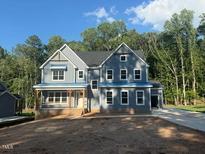 Beautiful new construction featuring a covered porch and craftsman-style architectural design at 70 Valebrook Ct, Youngsville, NC 27596