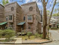 Unique townhouse featuring natural wood siding and a charming, modern design at 130 E Longview St # Apt K, Chapel Hill, NC 27516