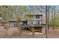 Charming home with a spacious deck perfect for outdoor entertaining and enjoying nature at 206 Rocky Hills Rd, Pittsboro, NC 27312