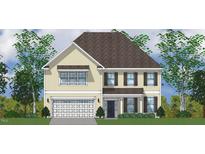 Charming two-story home with an attached two-car garage, neat landscaping and decorative shutters at 303 Augusta Pond Way # 166, Raleigh, NC 27603