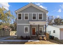 Charming two-story home featuring a welcoming front porch and light gray siding at 2207 Otis St # B, Durham, NC 27707