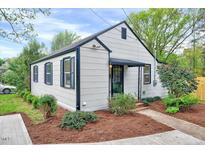 Charming single-story home with tidy landscaping, enhancing its curb appeal and cozy aesthetic at 829 Colleton Rd, Raleigh, NC 27610