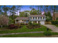 Charming two-story home featuring well-maintained landscaping and a welcoming front porch at 1205 Country Ridge Dr, Raleigh, NC 27609
