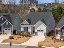 Charming single-Gathering home with stone accents, a front-entry garage, and well-manicured lawn at 1241 White Flint Cir, Durham, NC 27703