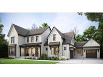 Charming two-story home boasts a brick and siding facade, complemented by a manicured lawn and inviting front porch at 1644 Legacy Ridge Ln, Wake Forest, NC 27587