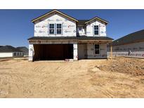 Two-story home under construction with an attached two car garage at 18 W Emily Gardens Dr, Selma, NC 27577