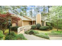 Charming home featuring a ramp, chimney, and lush landscaping at 2765 Rue Sans Famille, Raleigh, NC 27607