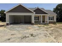 Newly constructed one-story home with a two-car garage and stone and shingle accents on the facade at 28 Bailey-Boykin Rd, Selma, NC 27576