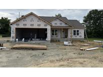 New construction featuring an attached garage, covered entry, and bright windows at 28 Bailey-Boykin Rd, Selma, NC 27576