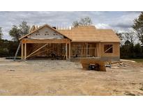 New construction home features a framed structure, highlighting its architectural design and construction process at 28 Bailey-Boykin Rd, Selma, NC 27576