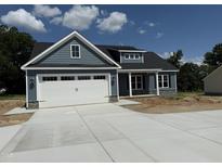 Charming new construction featuring a two-car garage and stylish gray siding at 40 Bailey-Boykin Rd, Selma, NC 27576
