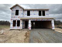 Two-story new construction home showing the framing and the garage that is being built at 43 Chloe Ct, Selma, NC 27577