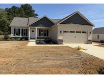Charming single-Gathering home featuring a two-car garage and craftsman-style architectural details at 47 Royal Ave, Selma, NC 27576