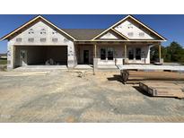 New construction home featuring an attached two car garage awaiting finishing touches at 56 Bailey-Boykin Rd, Selma, NC 27576