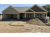 New construction home featuring a light green exterior, gray roof, and an open garage at 56 Bailey-Boykin Rd, Selma, NC 27576