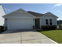 Charming single-story home with a two-car garage and well-manicured lawn at 8 W Emily Gardens Dr, Selma, NC 27576