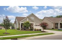 Charming single-Gathering home featuring stone accents, neutral siding, and an attached two-car garage at 1005 Vesper Ct, Durham, NC 27703