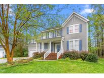 Charming two-story home featuring a cozy front porch and a well-manicured lawn at 101 Elk River Ct. Ct, Mebane, NC 27302