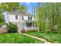 Charming two-story home featuring a covered front porch, landscaped yard, and fresh exterior paint at 200 Lincoln Ct, Raleigh, NC 27610