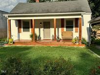 Charming home with a inviting front porch and well-maintained lawn at 2508 Albany St, Durham, NC 27705
