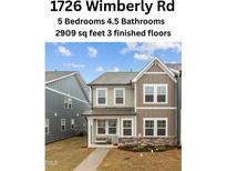 Charming two-story home with neutral siding, well-maintained landscaping, and inviting curb appeal at 1726 Wimberly Rd, Apex, NC 27523