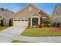 Charming single-story home with stone accents, manicured lawn, and attached two-car garage at 2112 Bradford Mill Ct, Apex, NC 27539
