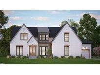 Charming two-story home featuring a painted brick facade, black window frames and a manicured lawn at 311 Culvert St, Apex, NC 27502