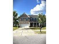 Charming two-story home with a well-manicured front yard and a two-car garage, perfect for suburban living at 317 Hope Valley Rd, Knightdale, NC 27545