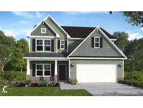 Charming two-story home with a two car garage and a landscaped yard at 25 Malbec Way, Youngsville, NC 27596