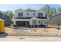 New two-story home with white siding, dark shutters, and an attached two-car garage at 3841 Rosebush Dr, Zebulon, NC 27597