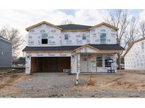 Under construction home showcasing the exterior with Tyvek HomeWrap, windows and the roof installed at 3841 Rosebush Dr, Zebulon, NC 27597