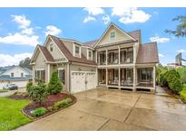 Stunning two-story home featuring a welcoming front porch and manicured landscaping, creating inviting curb appeal at 528 Clifton Blue St, Wake Forest, NC 27587