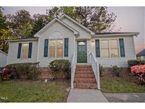 Charming single-story home with a welcoming front porch and well-maintained landscaping at 1204 Amberstone Dr, Knightdale, NC 27545