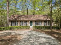 Charming single-story home featuring a well-maintained lawn, symmetrical design, and inviting entrance at 922 Royal Oaks Dr, Durham, NC 27712