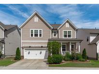Charming two-story home with landscaped yard and a two car garage, perfect for a growing Gathering at 3262 Ripley River Rd, New Hill, NC 27562