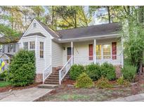 Charming single-story home with a welcoming front porch and well-maintained landscaping at 707 Cross Timbers Dr, Durham, NC 27713