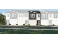 Charming new construction two-story townhome featuring a one car garage and modern design at 1112 Merlot Hills Ln, Durham, NC 27704