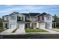 Charming townhomes showcasing varied siding colors and attached garages against a bright blue sky at 152 Parker Ln, Mebane, NC 27302