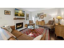 Inviting living room featuring a fireplace, plush seating, and stylish decor at 19 Lansgate Ct, Durham, NC 27713