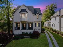 Charming two-story home with landscaped yard and inviting front porch at 3513 Bellevue Rd, Raleigh, NC 27609